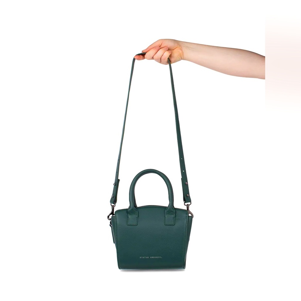 STATUS ANXIETY WORST BEHIND US GREEN BAG